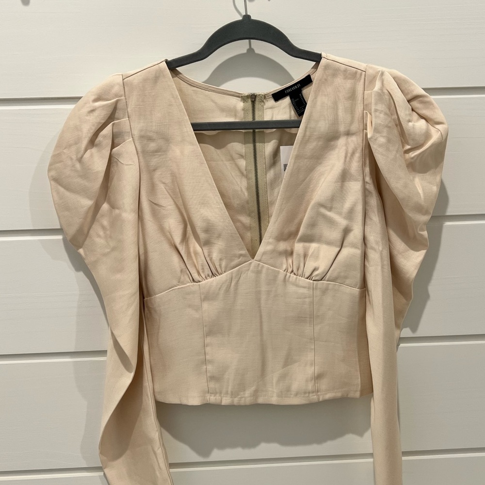 Light pink blouse, fluffed shoulders